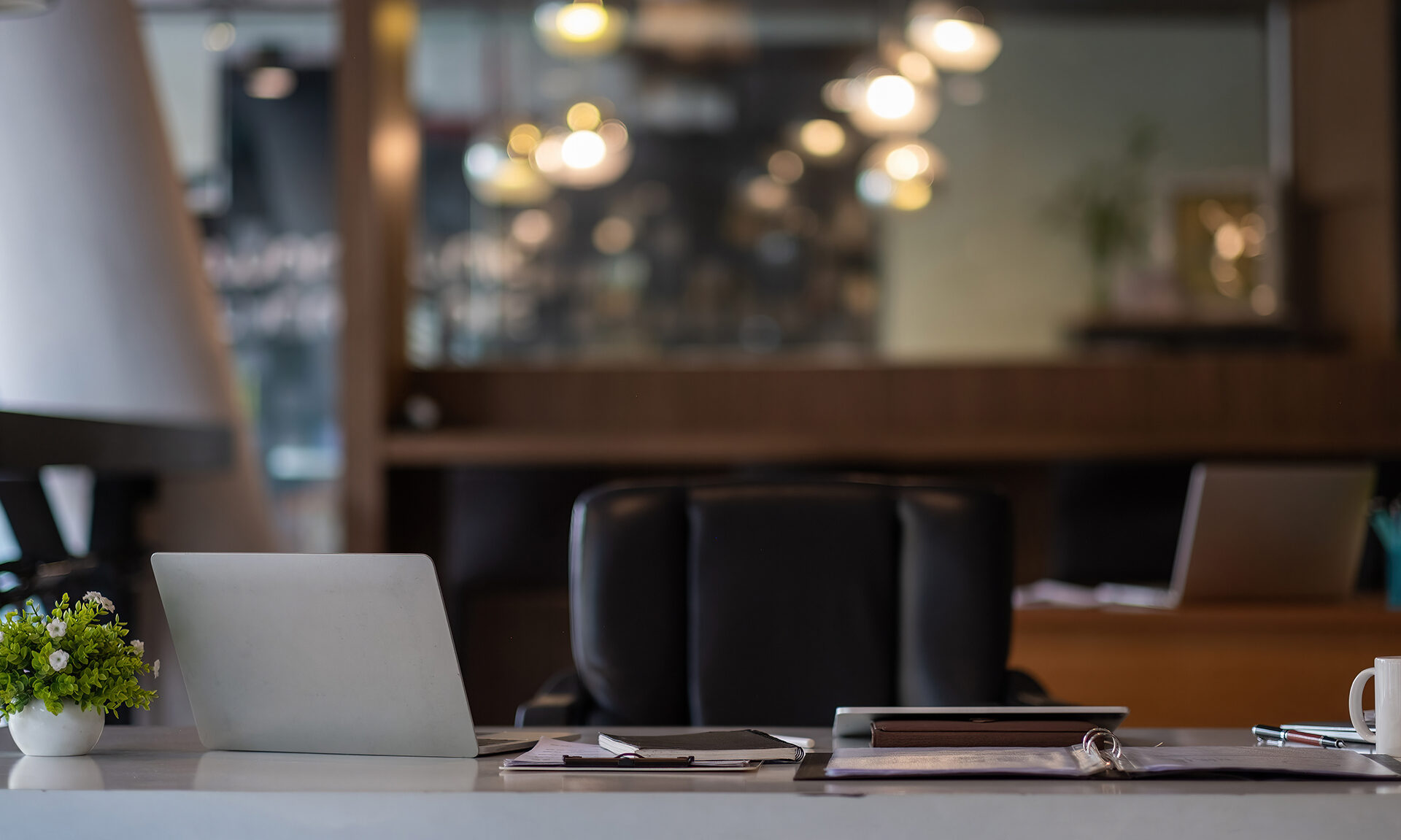 Small office with two laptops open on desks